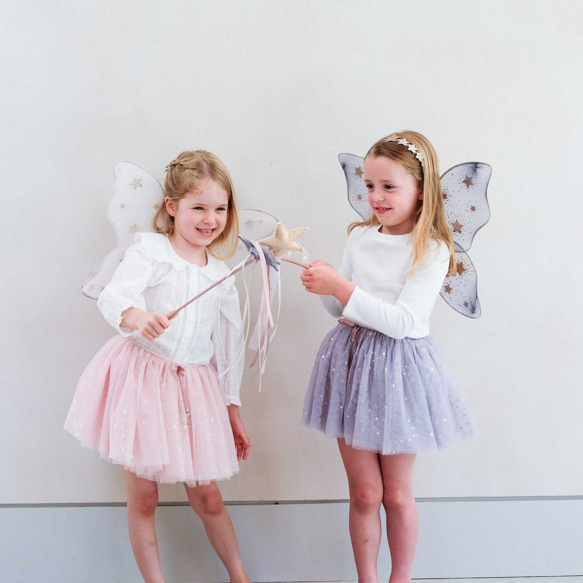 Pink and grey Mimi & Lula starry night wings styled for fairy dress-up