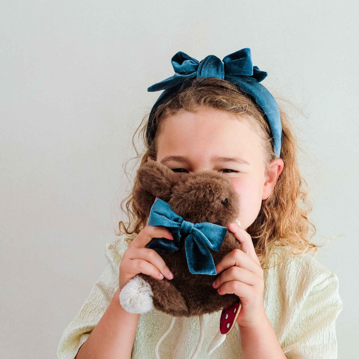 Child carrying the Mimi & Lula Winter Bunny Bag