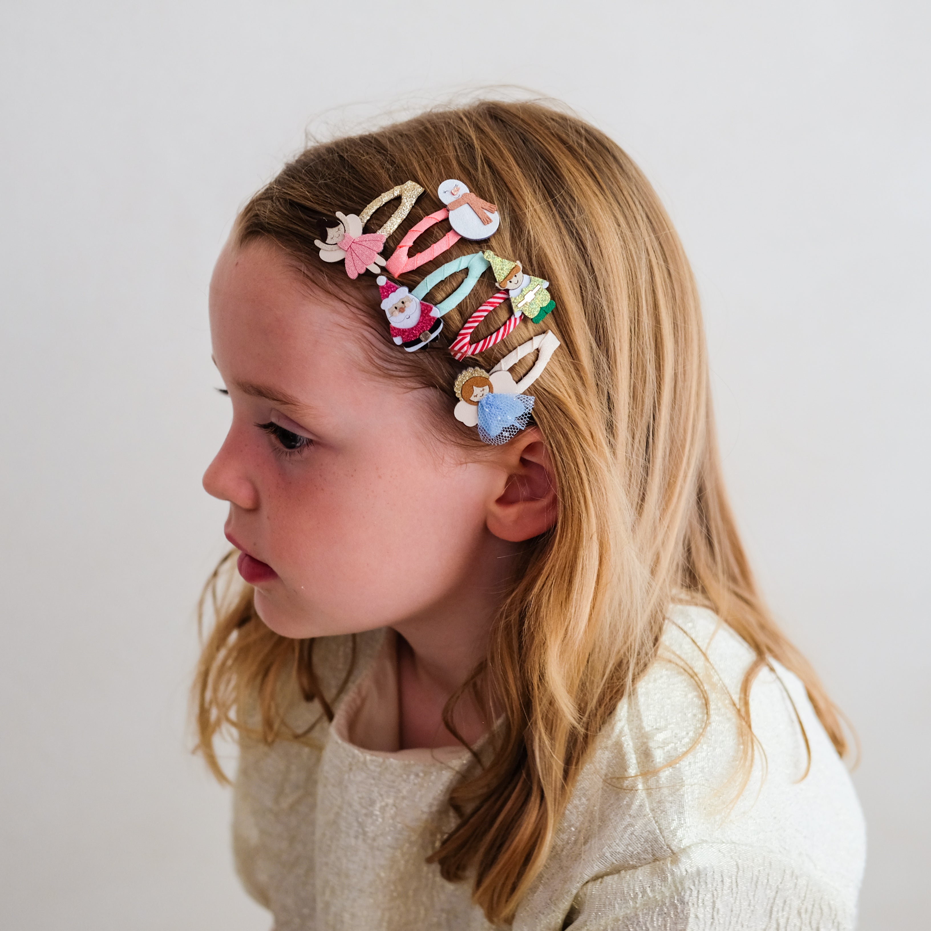 Child wearing Christmas character mini hair clips