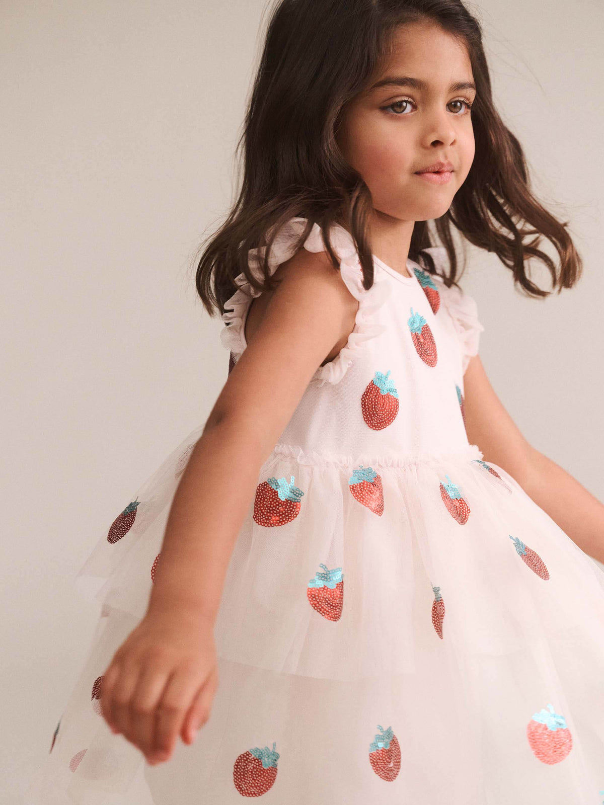 Huxbaby Sequin Strawberry Tulle Dress in Ecru, back lifestyle view