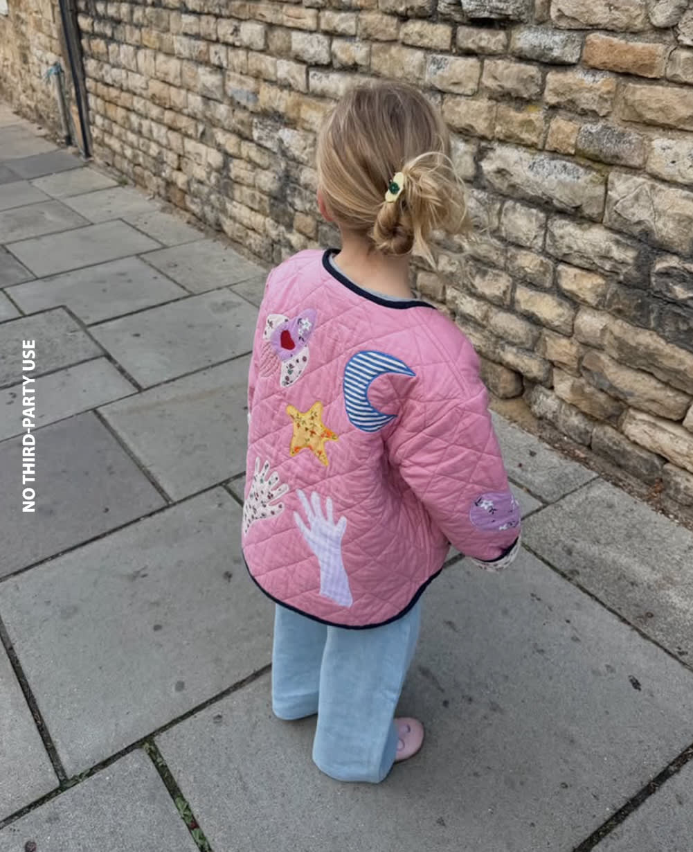 Sissel Edelbo back of the Cameo Pink quilted jacket worn outdoors