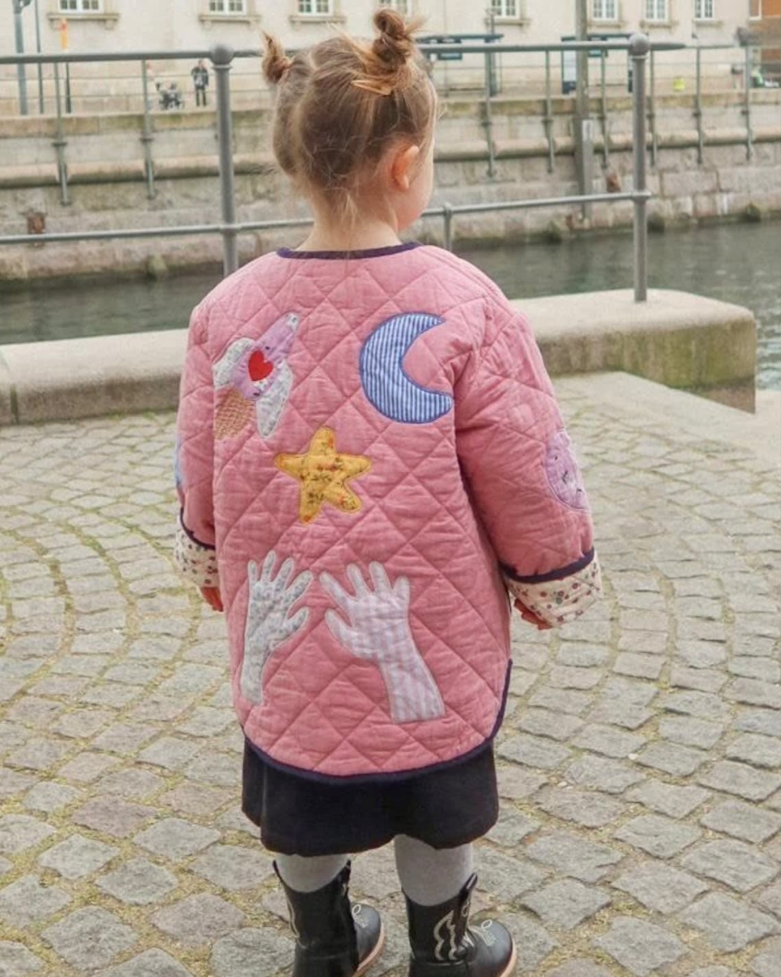 Sissel Edelbo back of the Cameo Pink jacket with moon and star appliqués