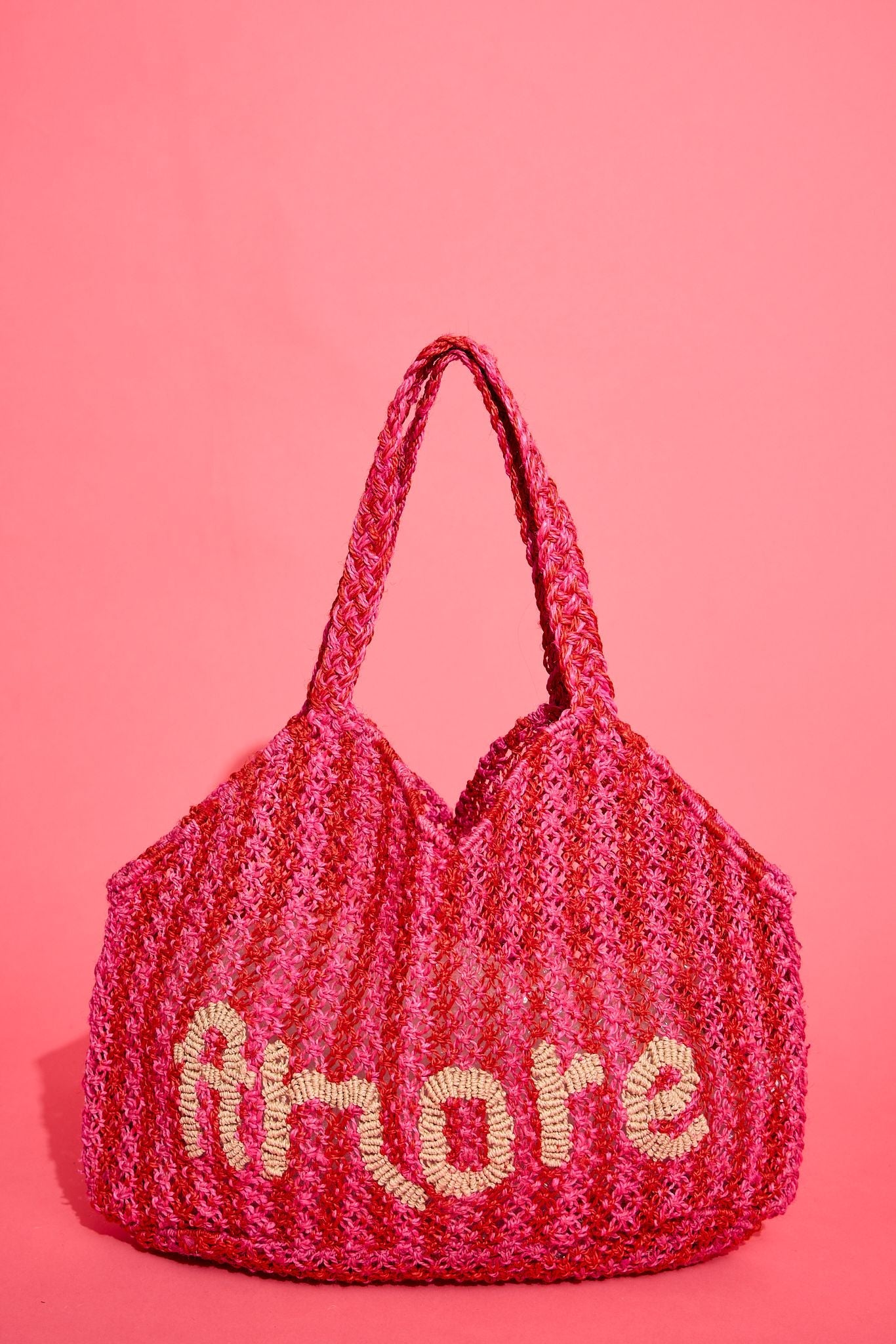 The Jacksons Amore handmade jute tote bag featuring the signature Amore design, crafted from natural jute for everyday carry, shopping, and beach adventures.