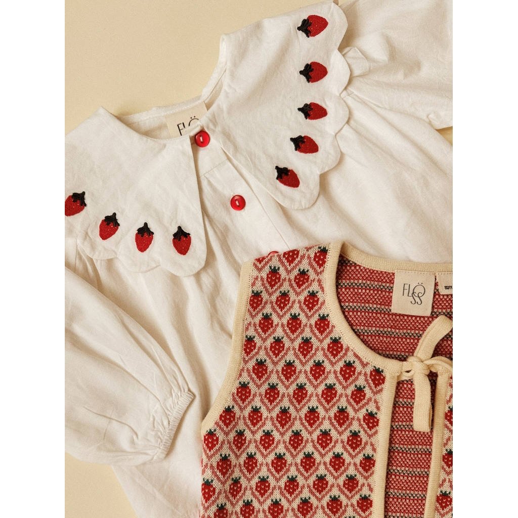 Flöss Everlyn Bright White Berry blouse collar styled with a strawberry knit vest
