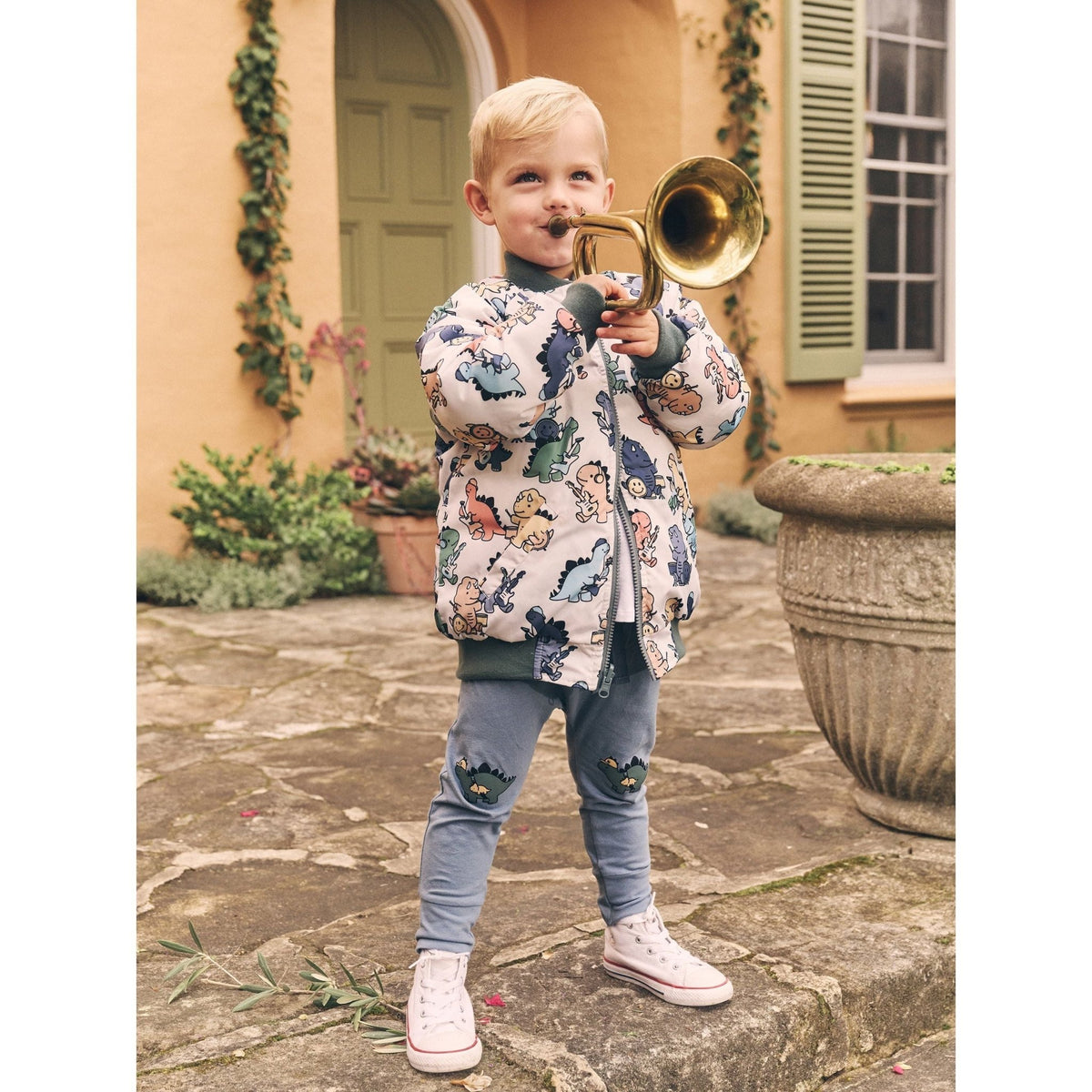 Huxbaby Adventure Dino pants worn for outdoor play