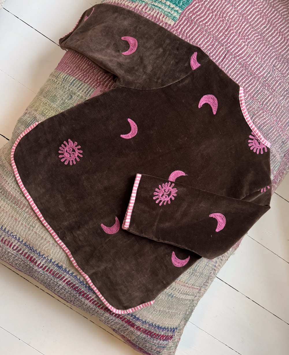 Sissel Edelbo close-up of pink sun and moon embroidery