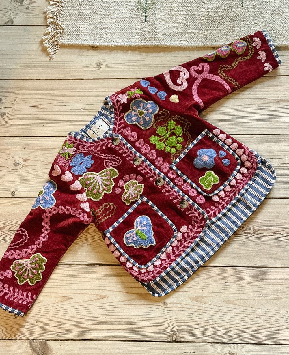 Sissel Edelbo close-up of Suzani embroidery and contrast trim