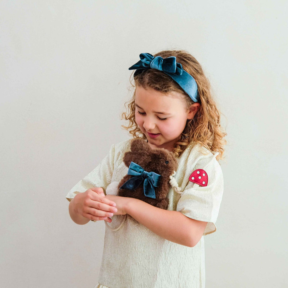 Child holding the Mimi &amp; Lula Winter Bunny Bag