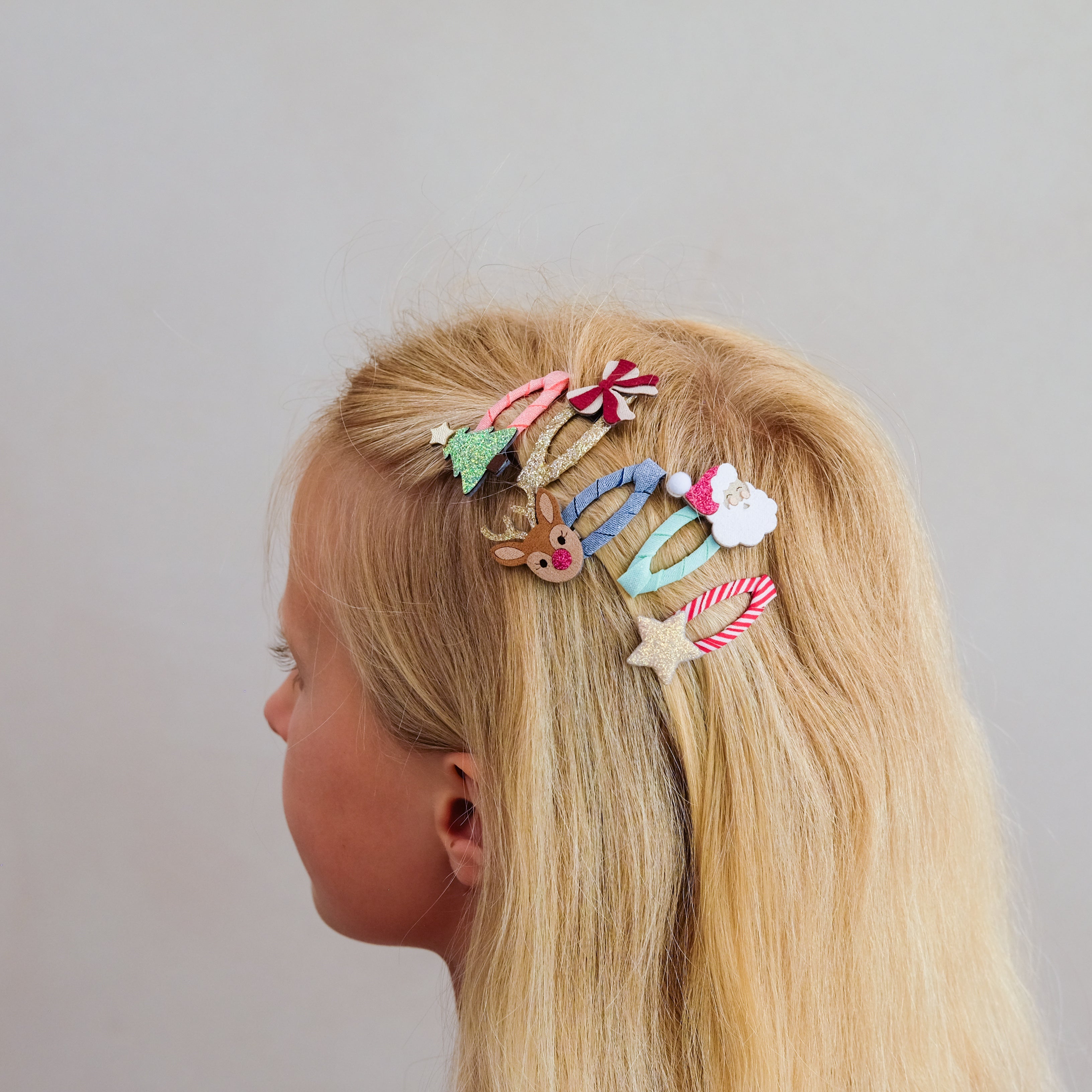 Christmas mini hair clips styled in a child&