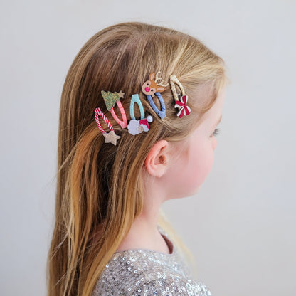 Child wearing Mimi &amp; Lula Christmas mini hair clips