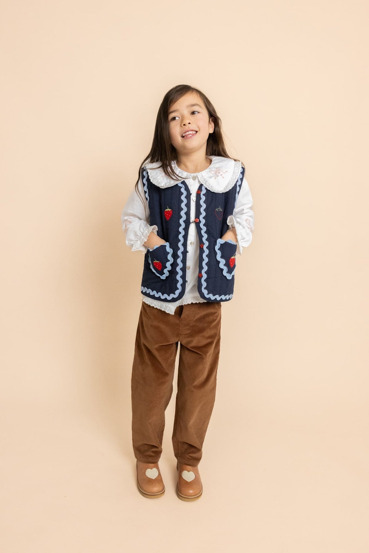 Child wearing Flöss Hannah Vest in New Navy