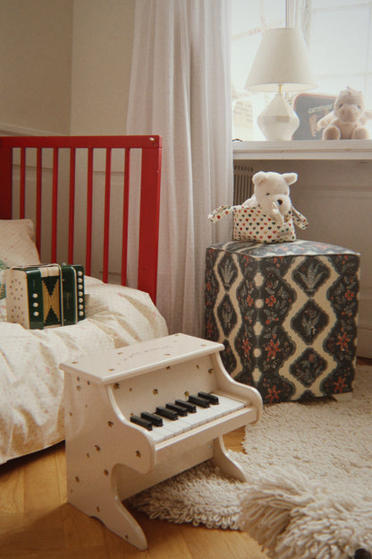 Konges Sløjd Lemon Piano in a playroom setting
