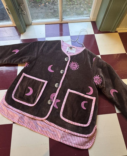 Sissel Edelbo front of the Sun &amp; Moon jacket laid flat