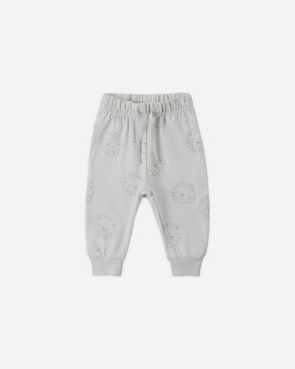 Light gray baby pants with floral patterns on a white background