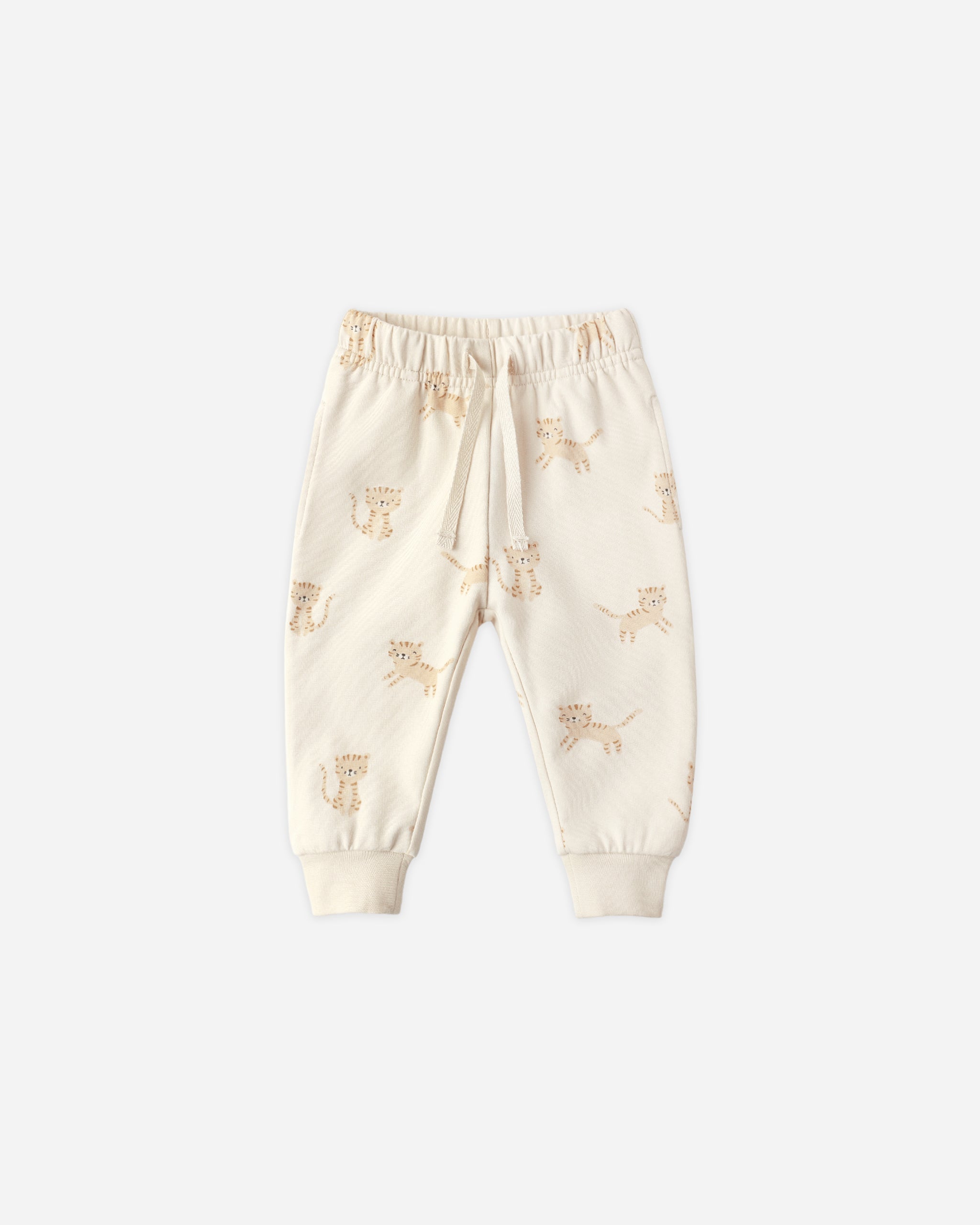Cream-colored baby pants with a subtle pattern