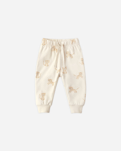 Cream-colored baby pants with a subtle pattern
