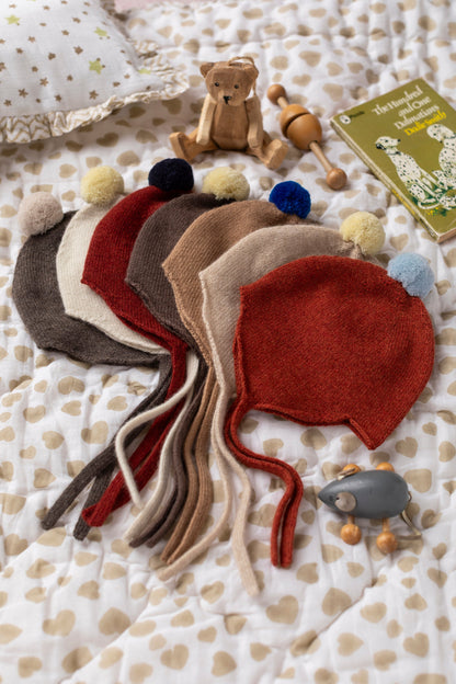 Rosie Sugden Rust and Spa Blue cashmere baby bonnet detail