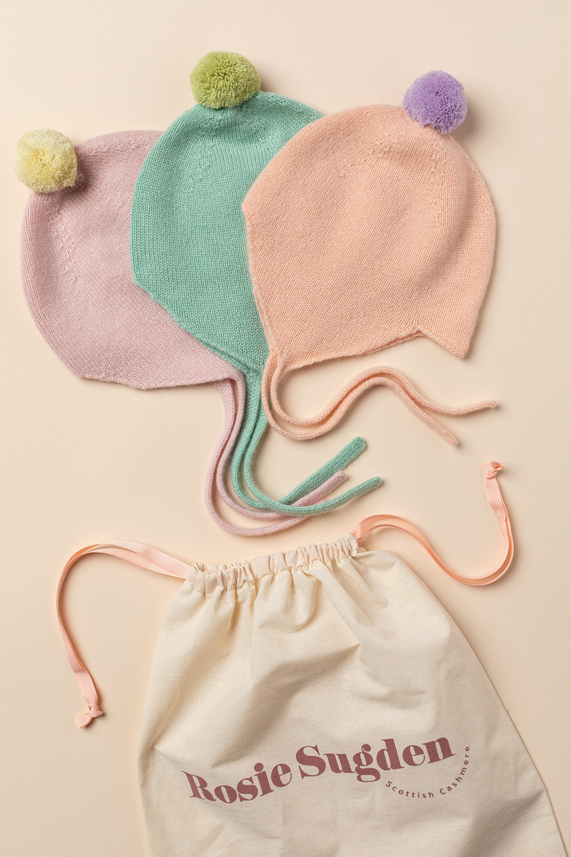 Rosie Sugden Peach cashmere baby bonnet gift image