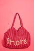 The Jacksons Amore handmade jute tote bag featuring the signature Amore design, crafted from natural jute for everyday carry, shopping, and beach adventures.