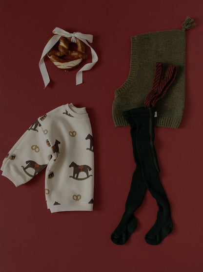 Silly Silas Footed Dark Forest Green Christmas Patterned — official lifestyle view 2