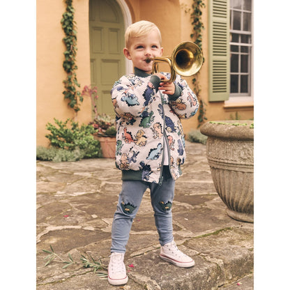 Huxbaby Adventure Dino pants worn for outdoor play