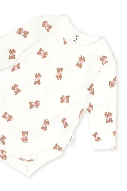 Huxbaby Tumbling Bow Huxette Long Sleeve Bodysuit in Almond Milk, detail view