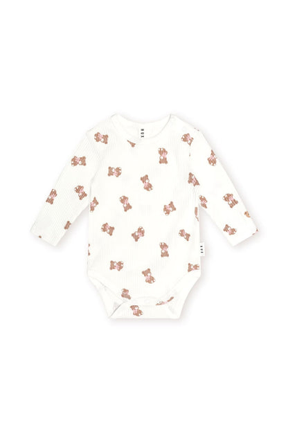 Huxbaby Tumbling Bow Huxette Long Sleeve Bodysuit in Almond Milk, front view