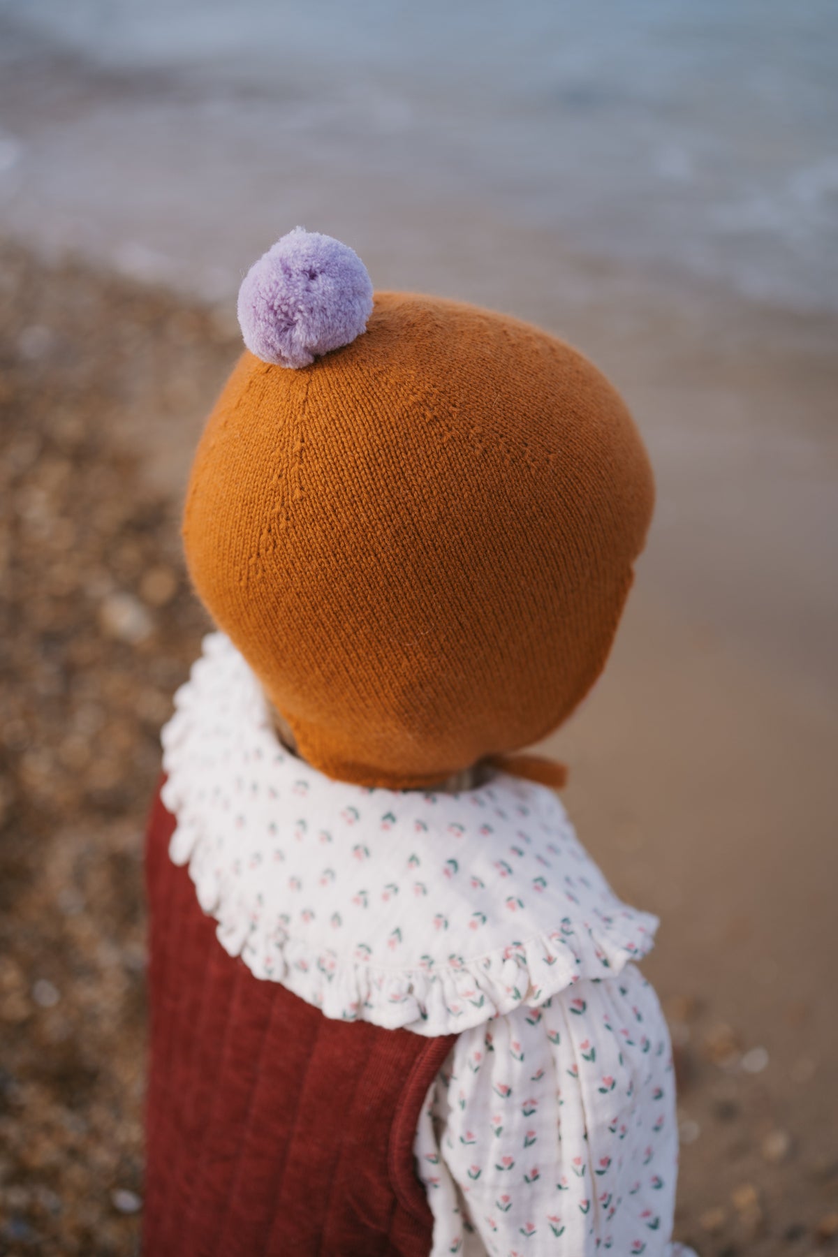 Rosie Sugden Ginger cashmere baby bonnet lifestyle image