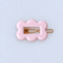 Kanel Fifi Hair Clip – 203 on a unified pale grey-white fabric background