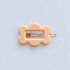 Kanel Fifi Hair Clip – 474 on pale grey-white fabric