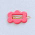 Kanel Fifi Hair Clip – 709 on a pale white textured fabric background