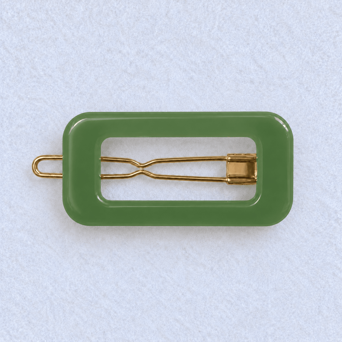 Kanel REC 354 rectangular hair clip in the merchant-approved reference green on a light fabric background