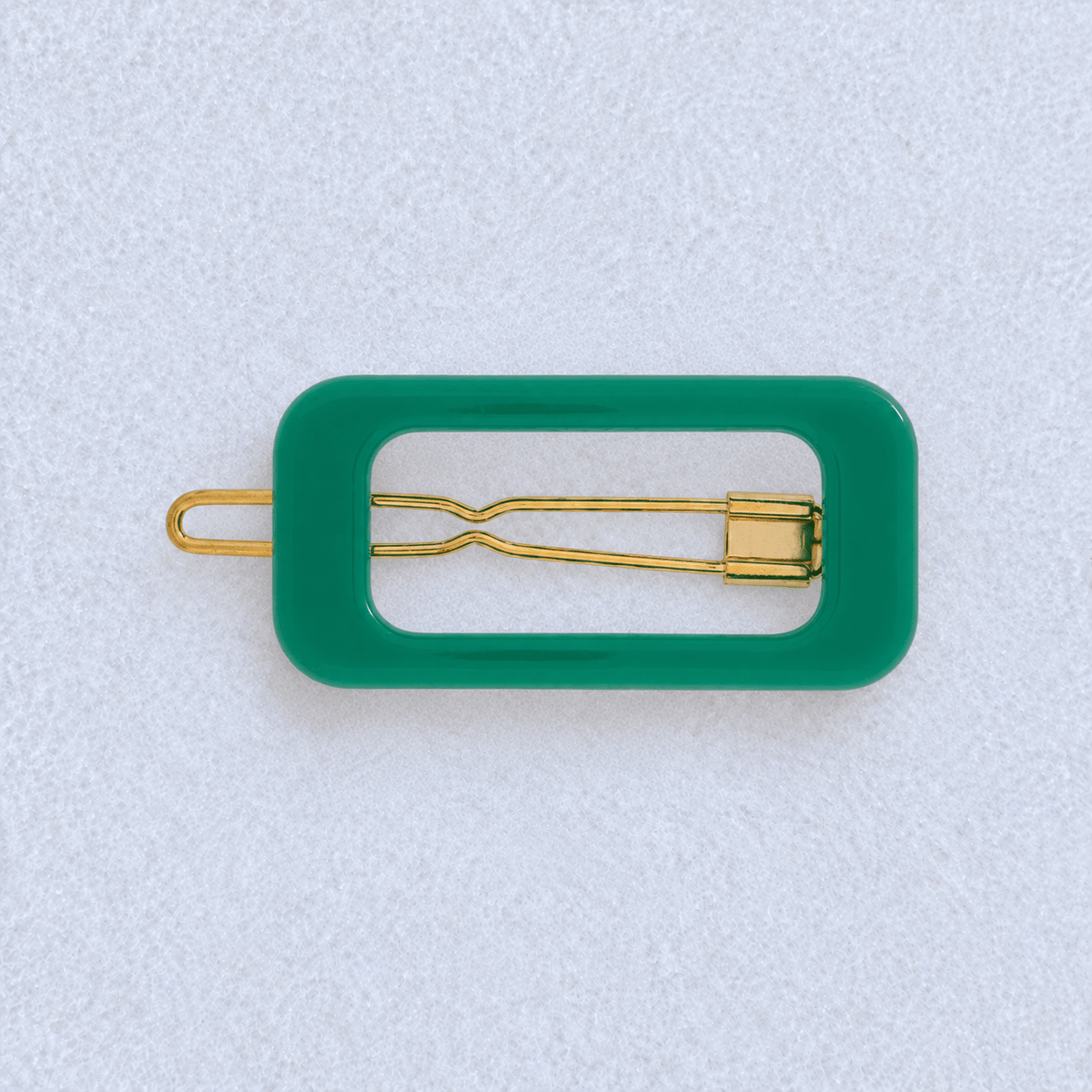 Kanel Rectangle Hair Clip – Green on a pale white textured fabric background