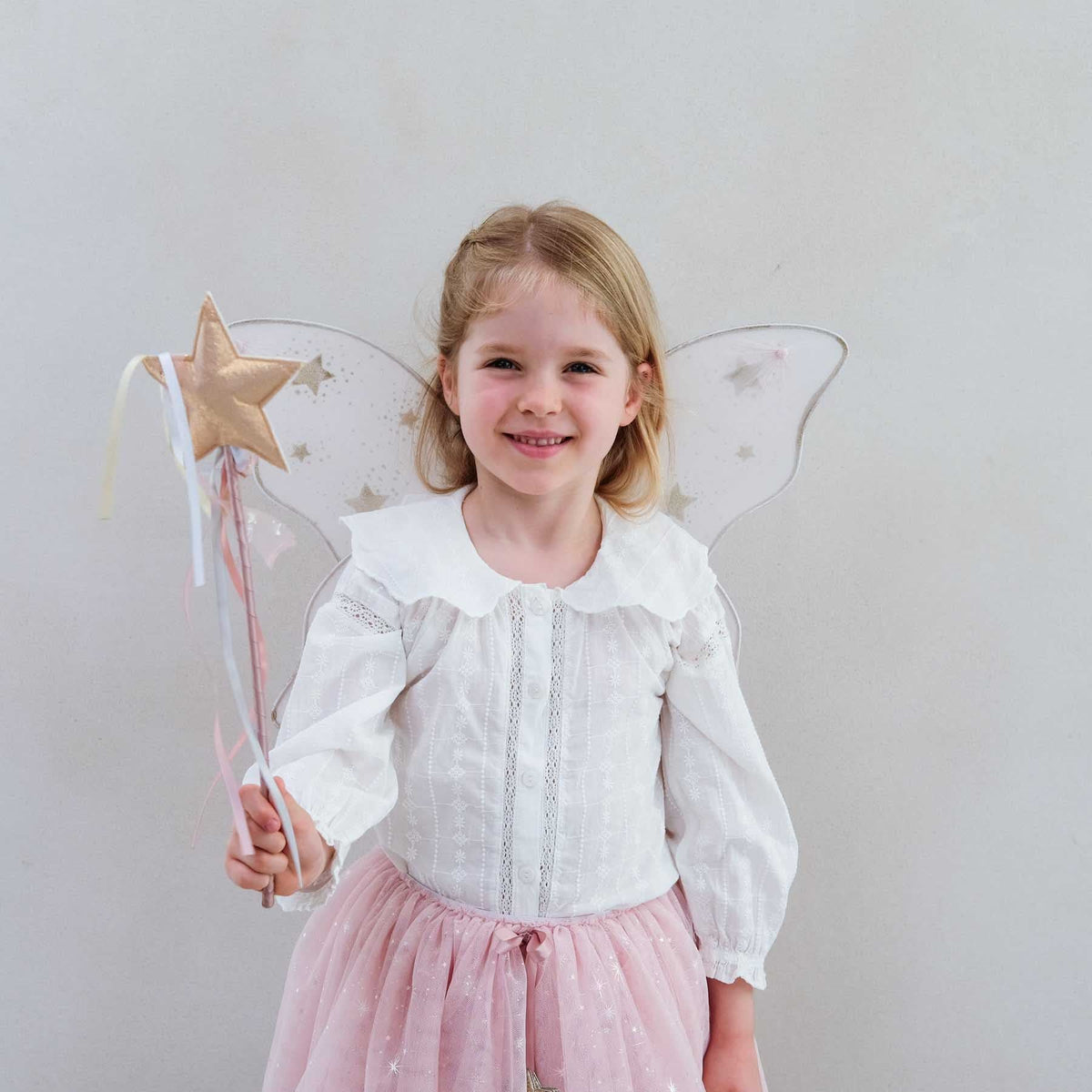 Mimi &amp; Lula pink starry night wings styled with a tutu and wand