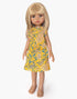 Minikane Adèle Amigas doll wearing a mustard vine floral Iva dress