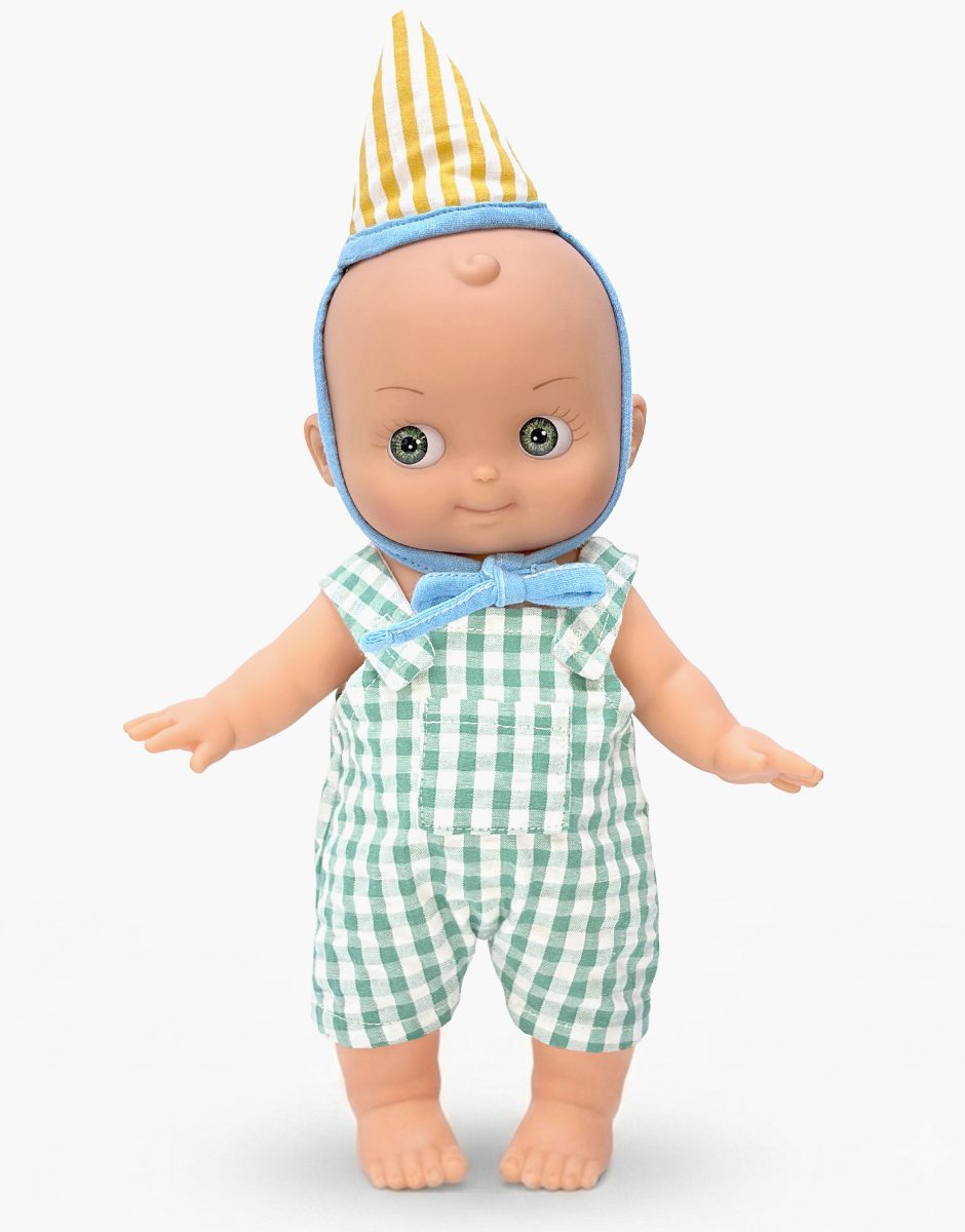 Minikane Zébulon Mini Panchas birthday doll in green gingham overalls