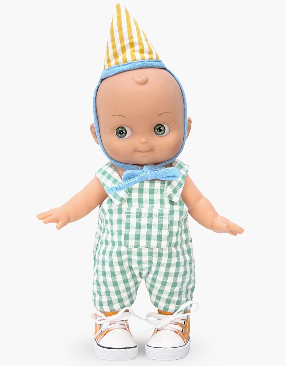 Minikane Zébulon Mini Panchas birthday doll in green gingham overalls