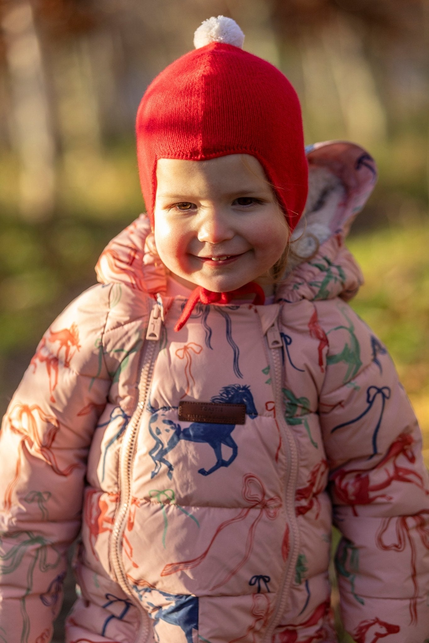 "My First Christmas" Cashmere Baby Bonnet, Festive Red with White Pom - Pom Rosie Sugden