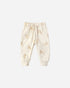 Cream-colored baby pants with a subtle pattern