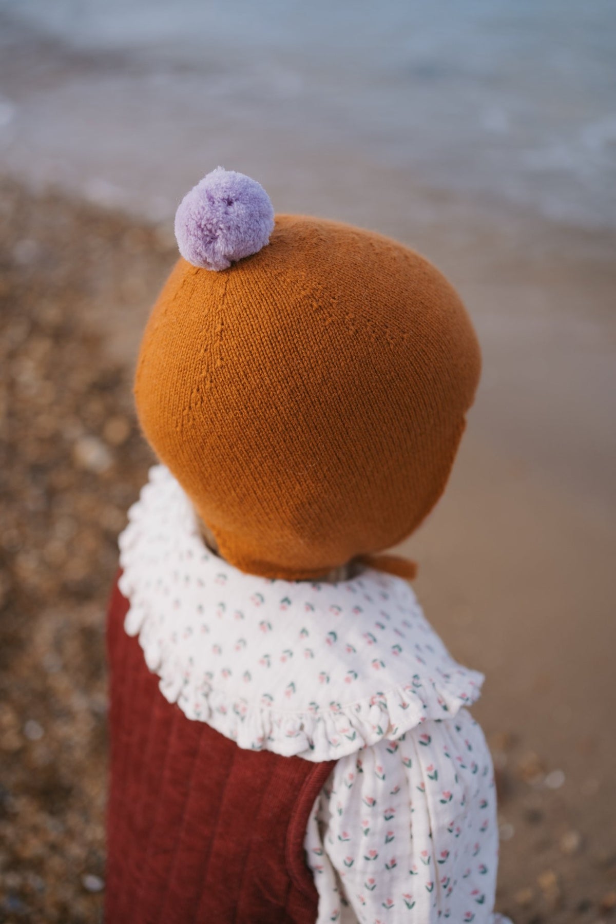 Rosie Sugden Ginger cashmere baby bonnet lifestyle image