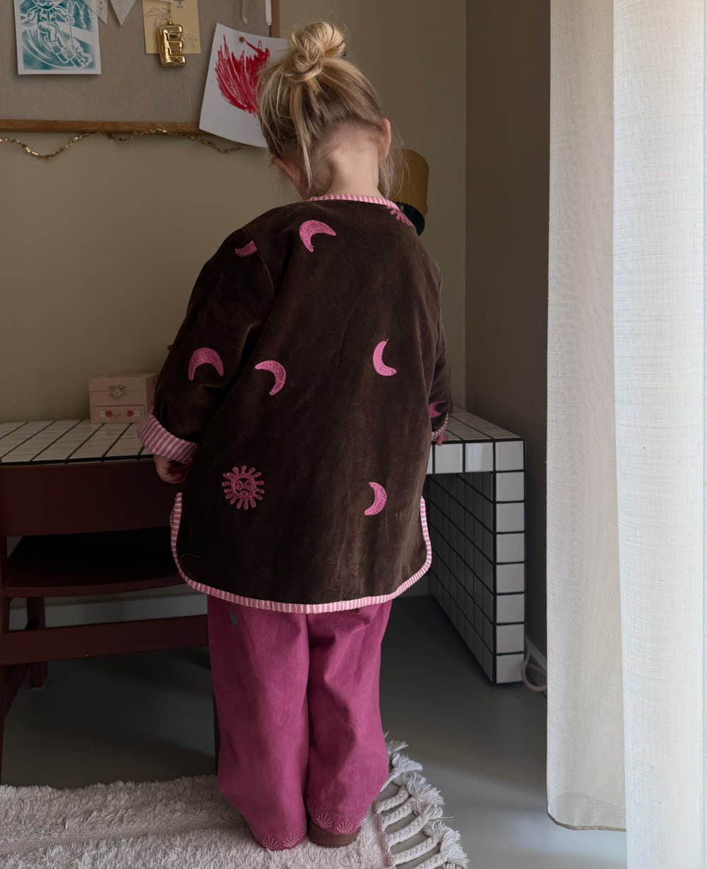 Sissel Edelbo back of the Sun &amp; Moon jacket worn indoors
