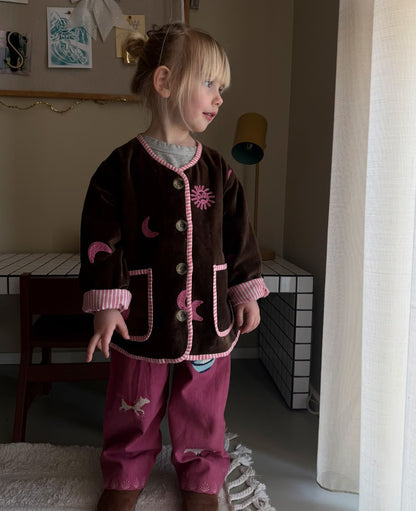Sissel Edelbo front of the brown Sun &amp; Moon jacket worn indoors