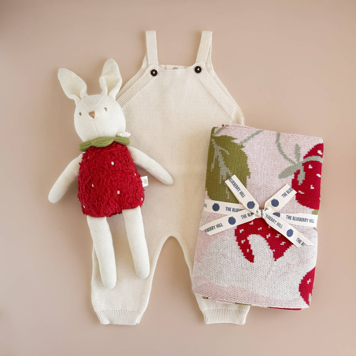 The Blueberry Hill baby outfit with bunny plush toy and Strawberry Bunny blanket
