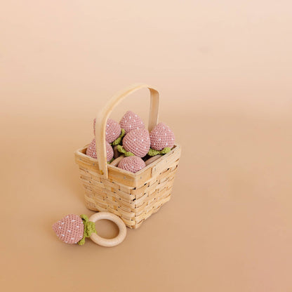 Wicker basket with The Blueberry Hill strawberry crochet baby teethers
