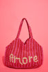 The Jacksons Amore handmade jute tote bag featuring the signature Amore design, crafted from natural jute for everyday carry, shopping, and beach adventures.